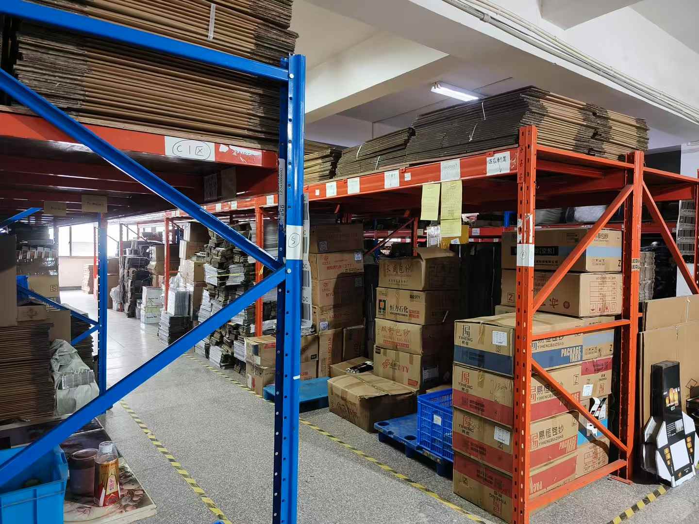 Carton and packaging materials organized for production.